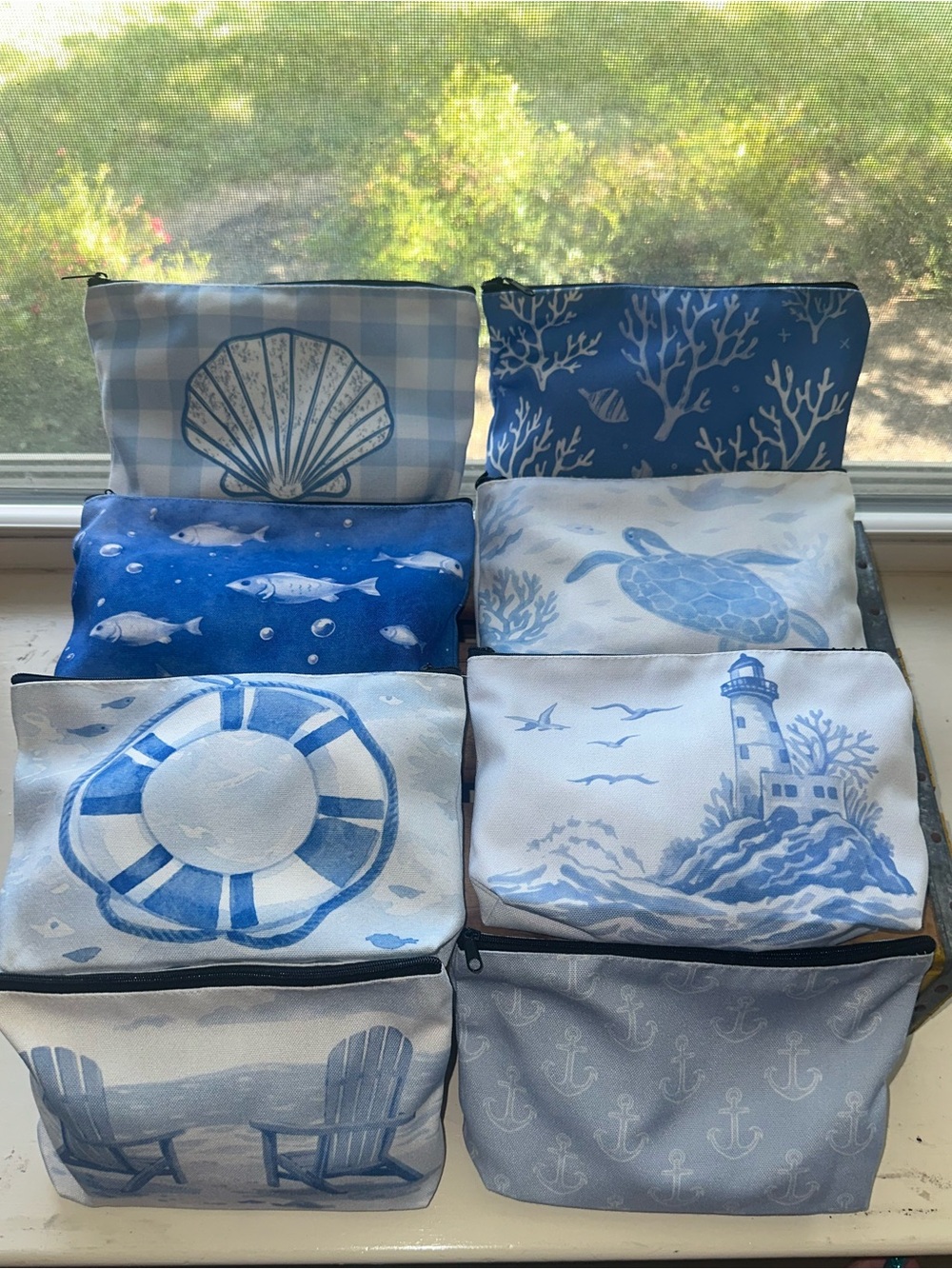 Cosmetic bag (1) with a seashell brush, headband, hand lotion, lip balm, skincar